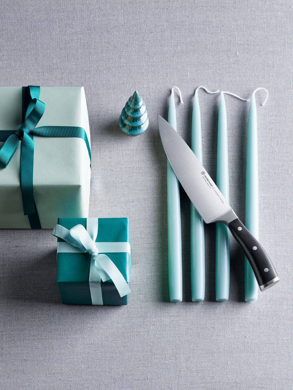 Classic Ikon Chef's Knife surrounded by presents