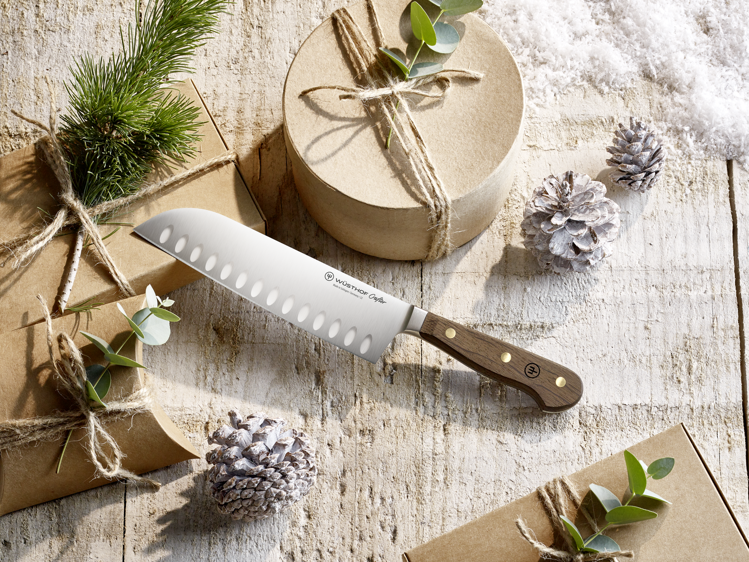 WÜSTHOF Crafter Santoku with presents wrapped in brown paper