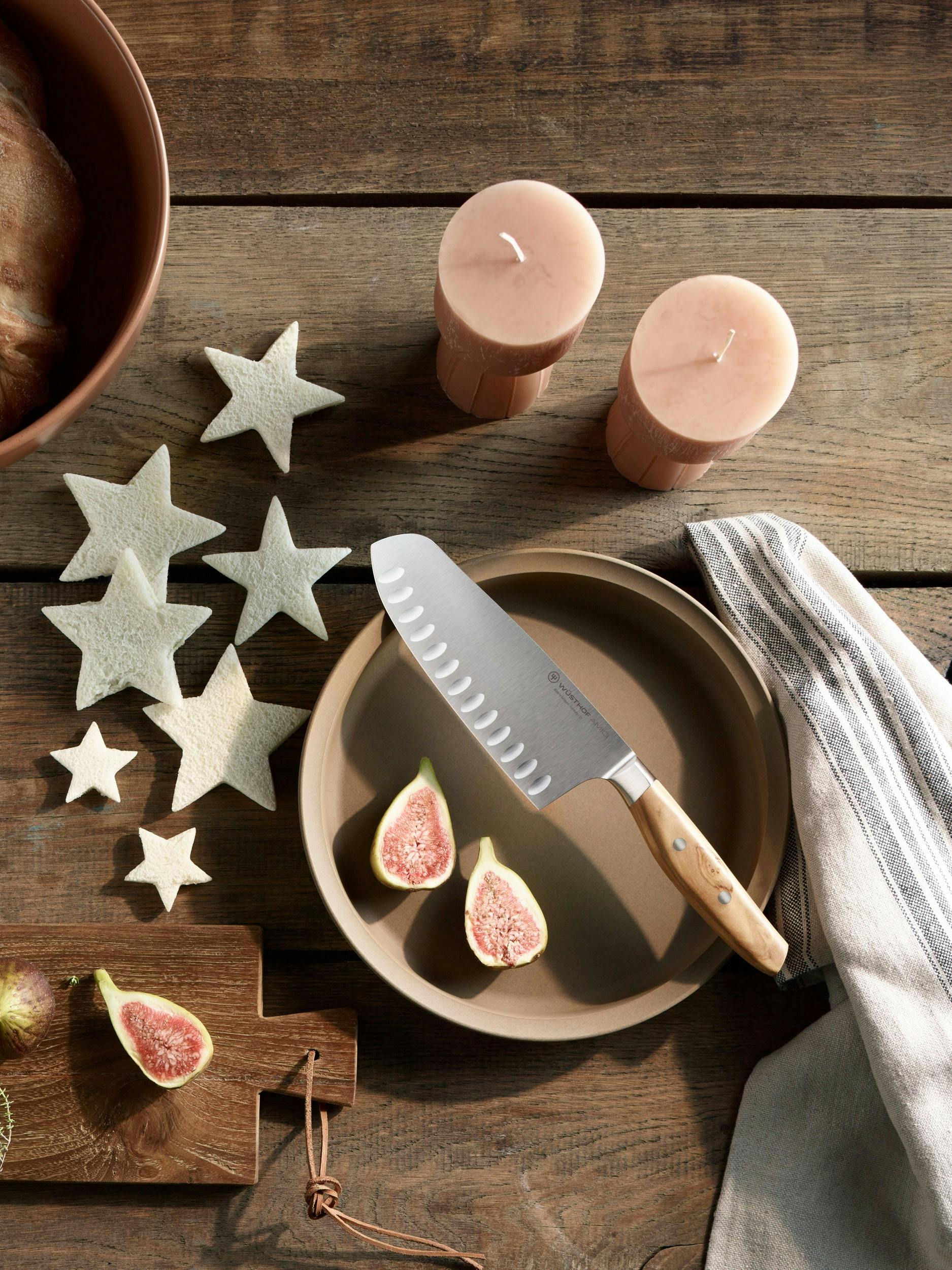 Amichi knife on table next to holiday cookies and candles