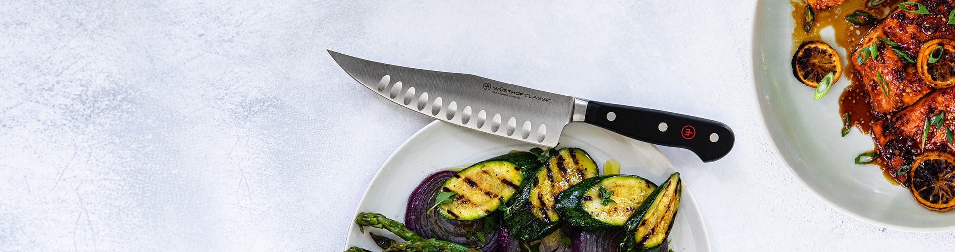 Knife on counter with zucchini