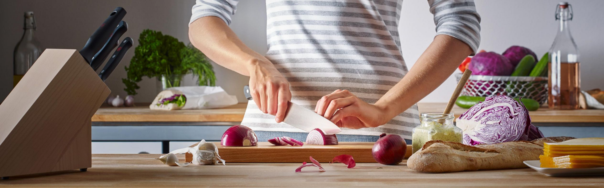 Woman Cutting a Red Onion