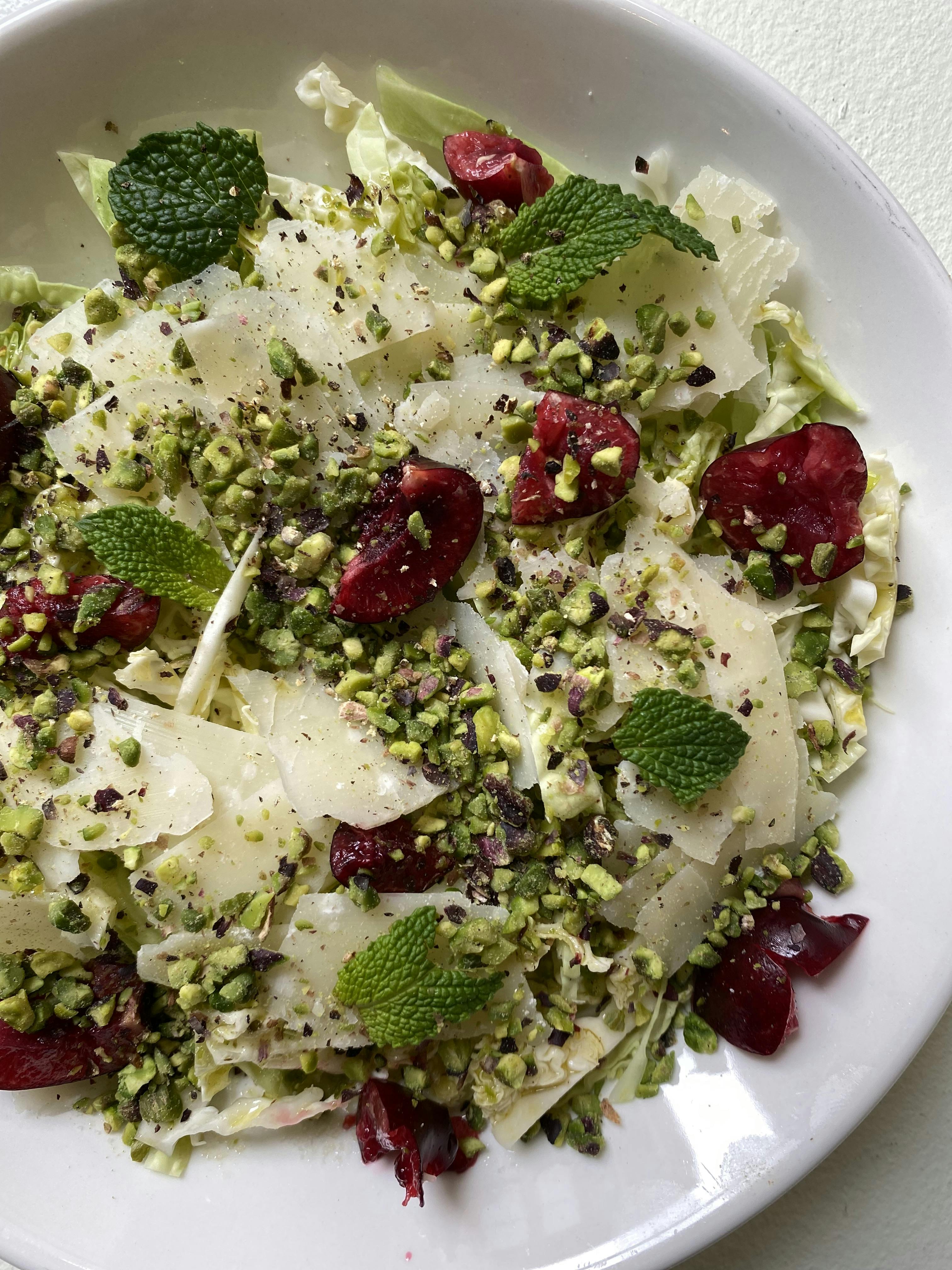 Cabbage Salad with Parmesan, Apples, Cherries, Pistachios and Mint close up