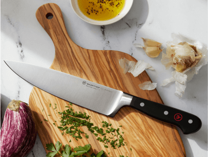 a wusthof chef knife on a cutting board